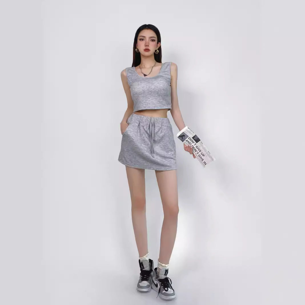 Tailored short vest with chest cushion and drawstring high waisted skirt