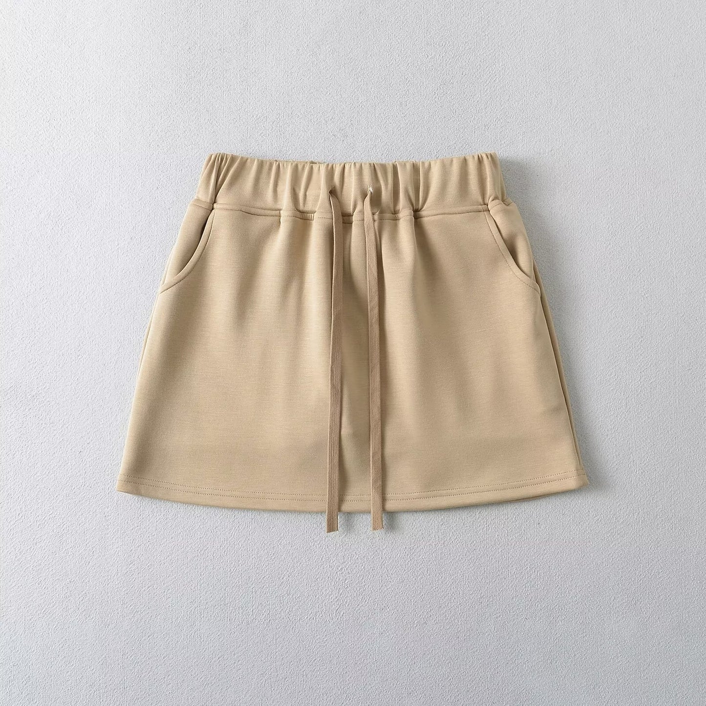 Tailored short vest with chest cushion and drawstring high waisted skirt